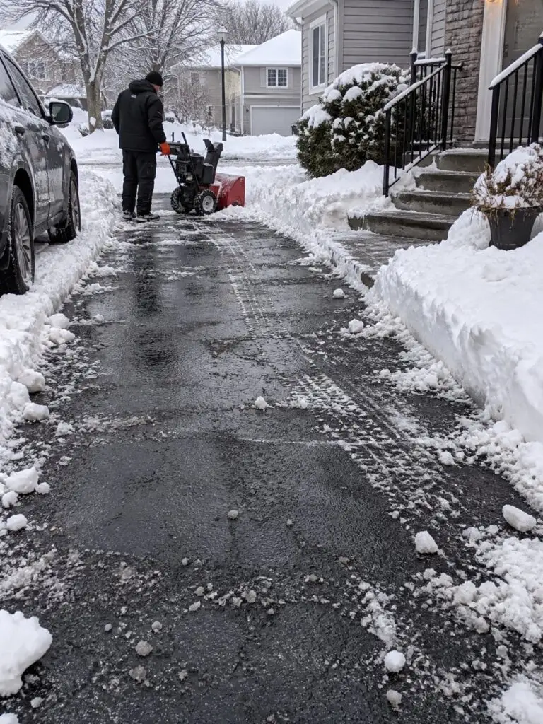 Residential driveway cleared down to the pavement after GMX snow removal in Milford, MA